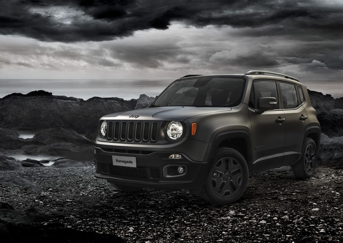 Jeep Renegade parked on rocky terrain near the ocean