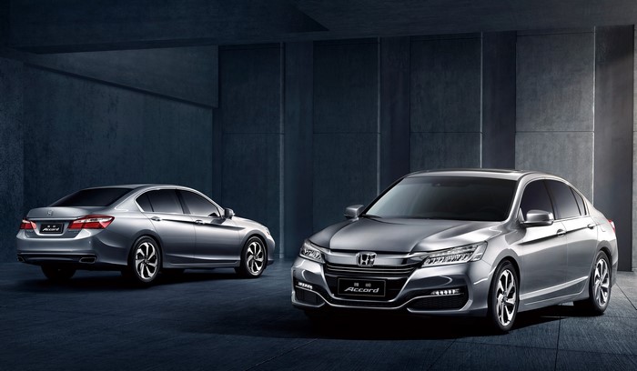Two silver Honda Accord sedans in a modern garage