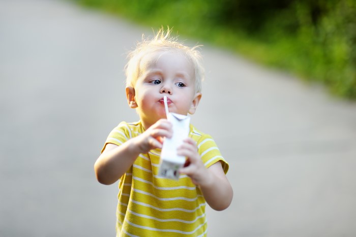 Boy drinking from a juice box