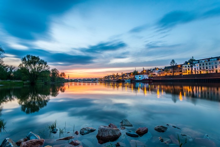 Arnhem, Netherlands waterfront at dusk with reflections