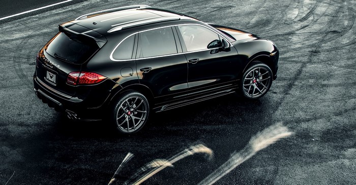 Black Porsche Cayenne Turbo on Wet Asphalt