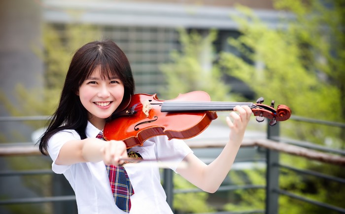 Asian girl playing violin