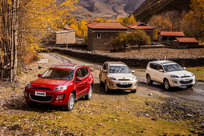 Three Geely Emgrand GX9 Pride SUVs in a Village