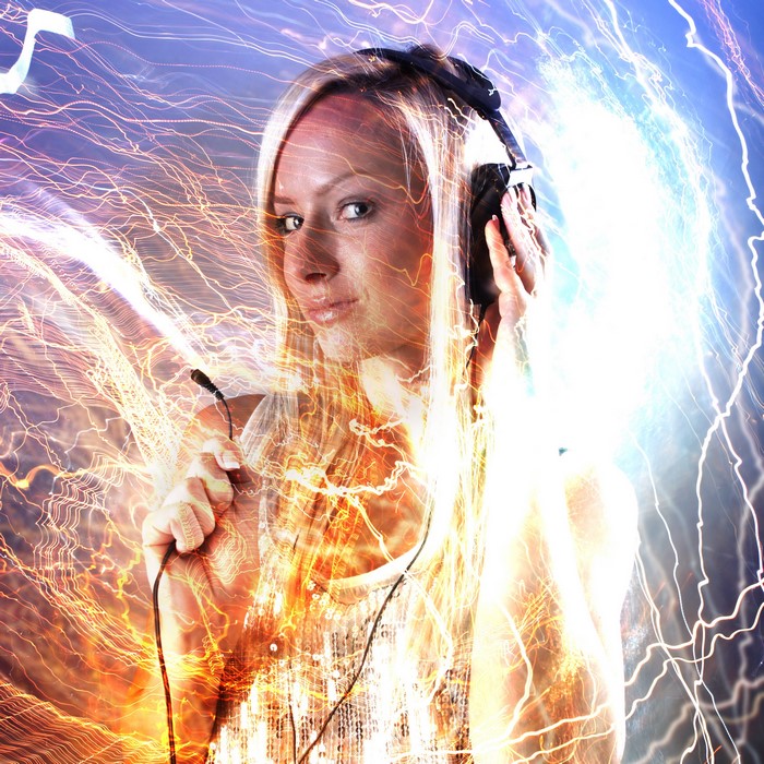 Woman wearing headphones with light effects