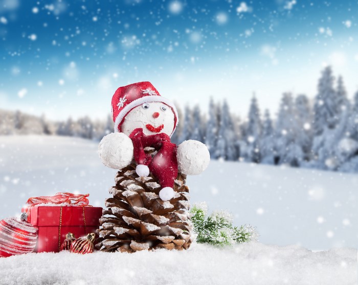 Christmas snowman made of pine cone with gifts and ornaments