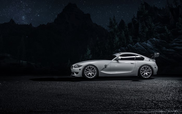 Silver BMW Z4M coupe at night with mountains