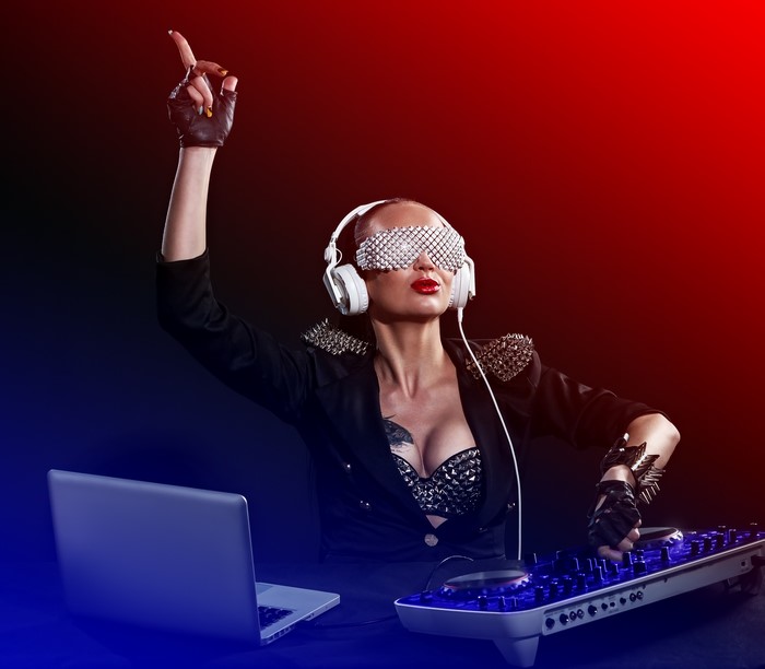 DJ with headphones and studded jacket