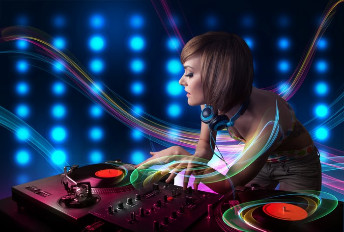 DJ with headphones playing records