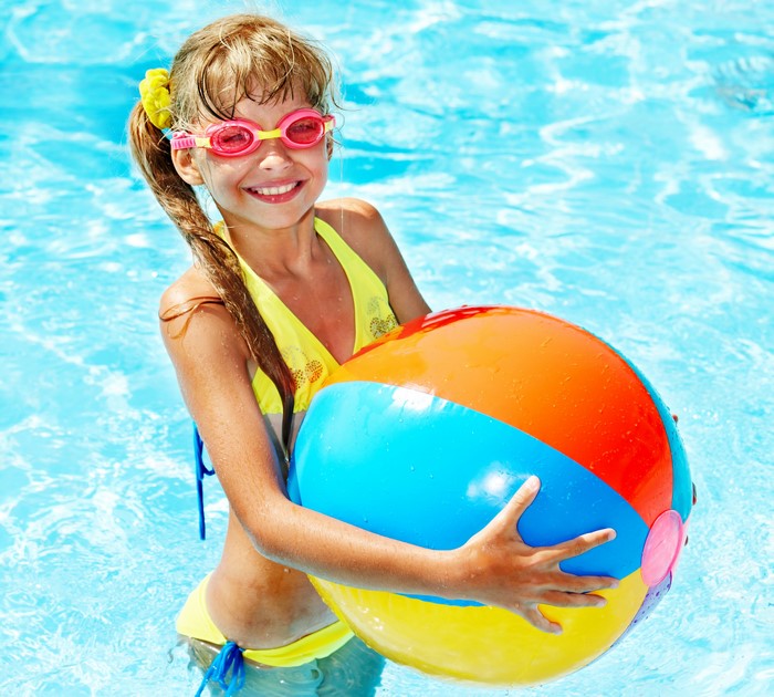 Smiling Girl with Beach Ball in Pool 4K