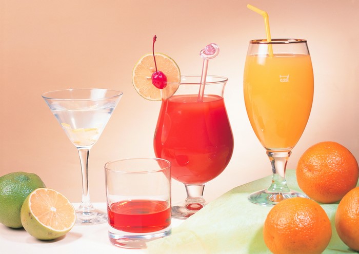 Assortment of colorful cocktails and fresh citrus fruits