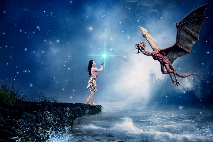 Girl reaching for star with dragon in starry sky