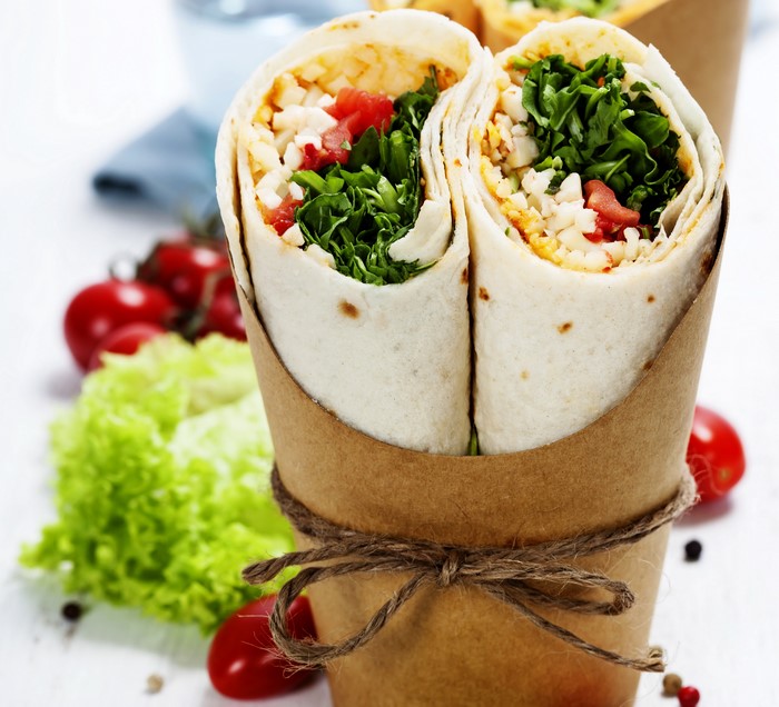 Two wraps with vegetables and tomatoes