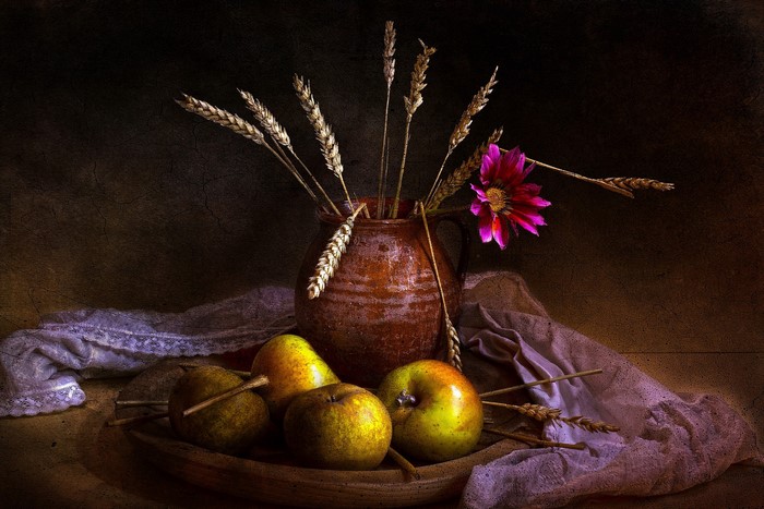 Still life with apples, pears, wheat, and a flower in a jug
