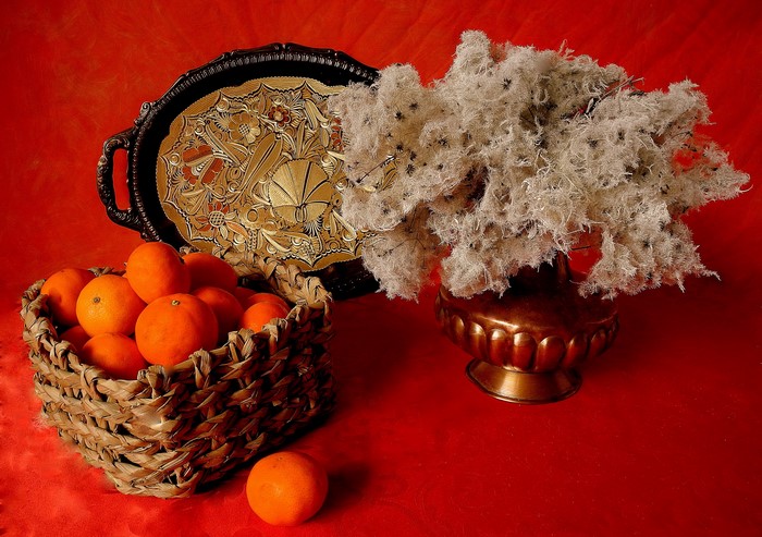 Still-life with mandarins in a wicker basket