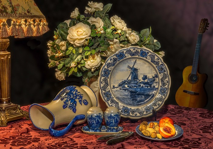 Still-life with Delftware plate, jug, and guitar