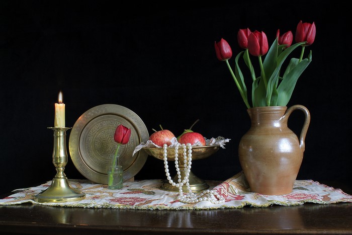 Still-life with tulips, apples, and candle