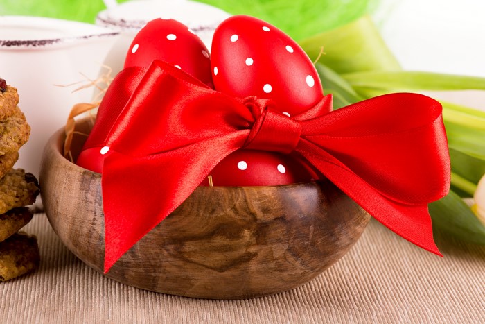 Red Easter Eggs with White Polka Dots in Wooden Bowl with Red Bow