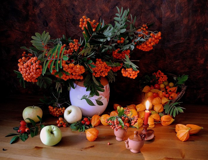 Still-life with apples, rowan berries, and a candle