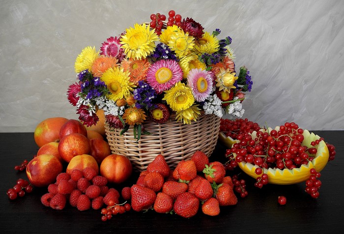 Still life of flowers and fresh fruits