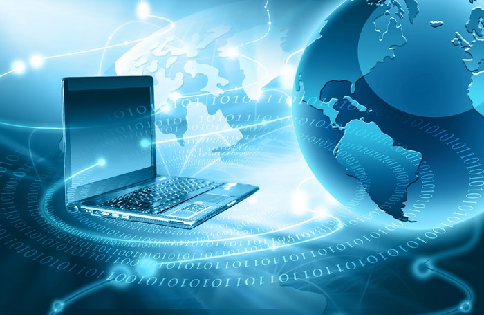 Laptop and Globe with Binary Code