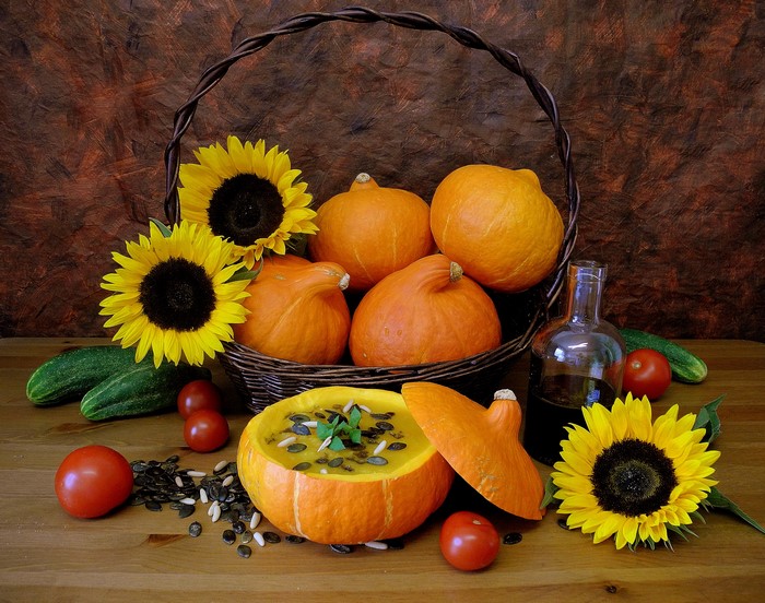 Still life with pumpkins, sunflowers, and soup