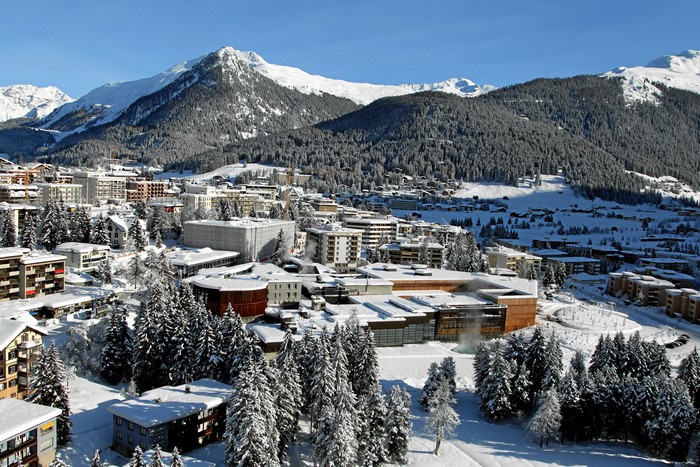 Davos, Switzerland in Winter with Snow-Covered Mountains and Houses