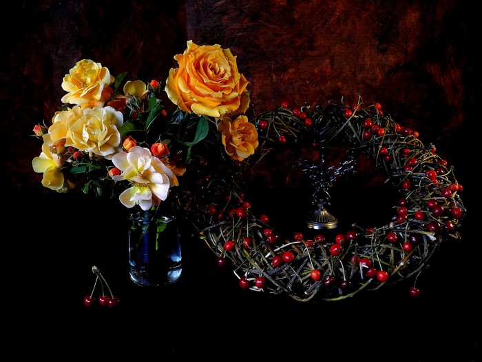 Yellow roses and cherries in a still life