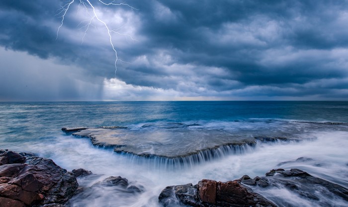 Lightning Strikes Over a Stormy Sea Coast