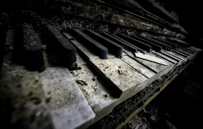 Close-up of an old, broken piano keyboard