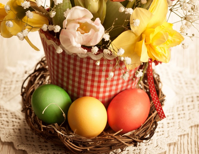 Easter eggs and flowers in a basket