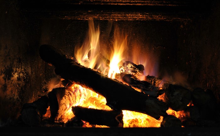 Fireplace with burning logs