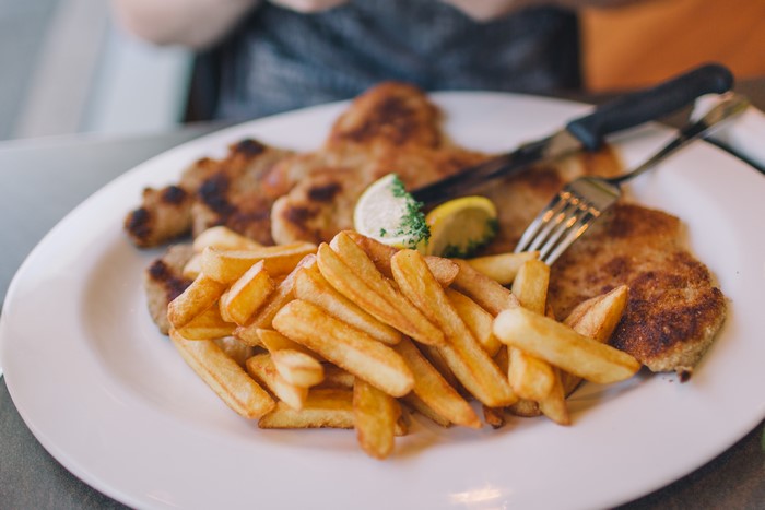 Schnitzel with French fries and lemon