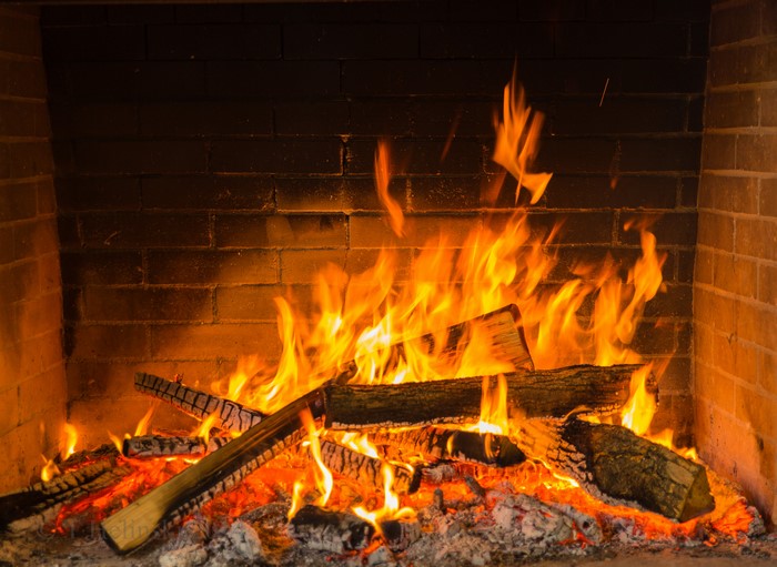 Fireplace with burning logs and embers