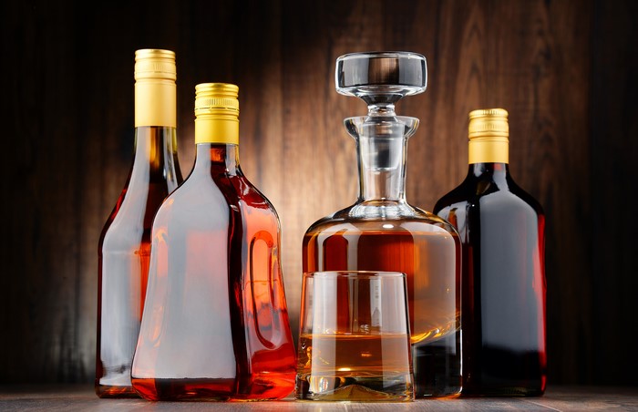 Bottles and decanter of amber liquid