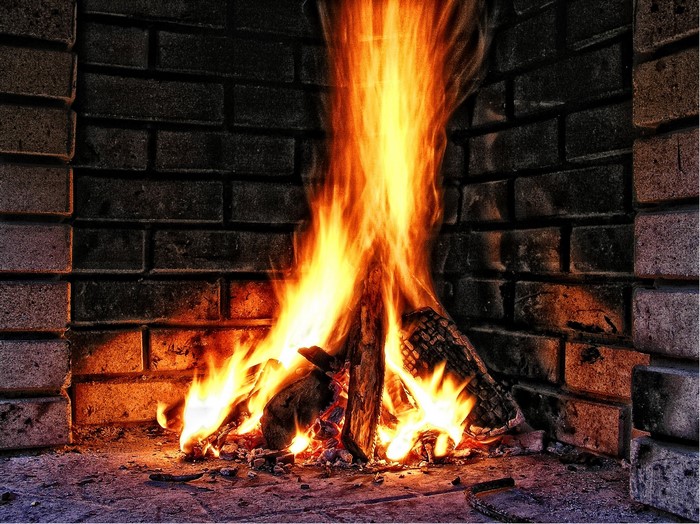 Fire burning in a brick fireplace