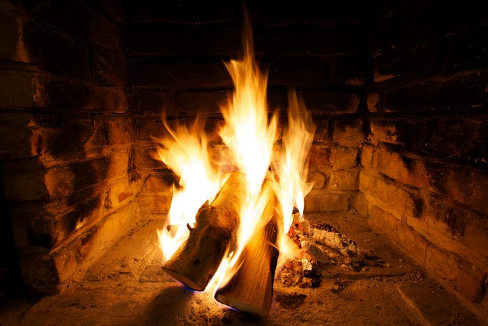 Fireplace with burning logs