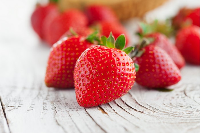 Strawberries on a wooden surface