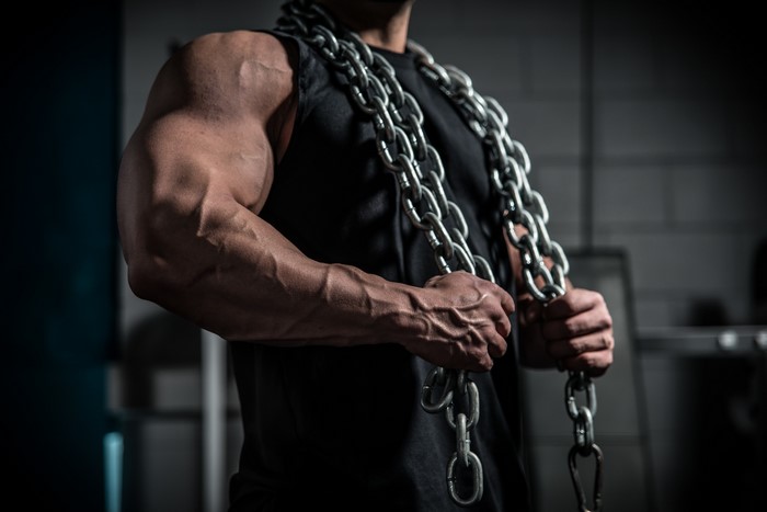 Man with chains in gym