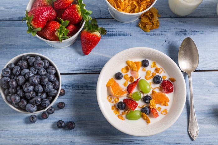Bowl of Cereal with Berries and Spoon
