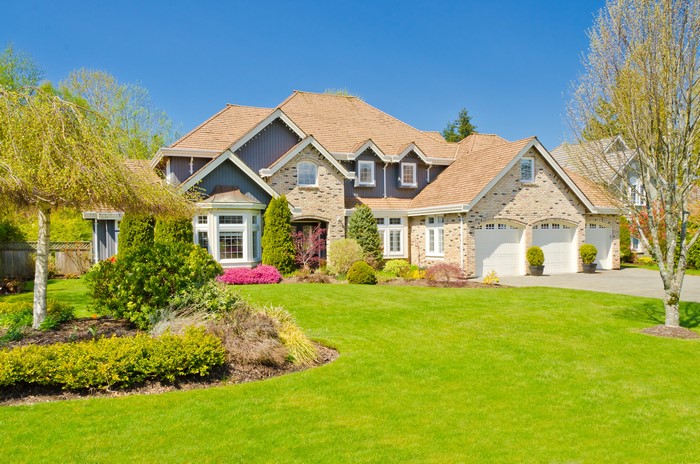 Elegant Suburban Mansion with Lush Green Lawn