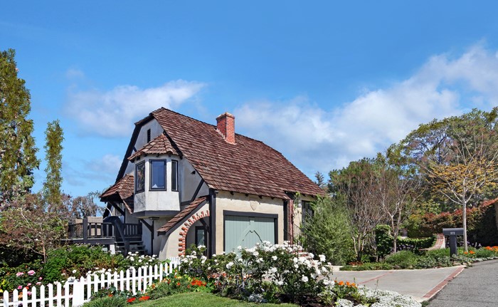 Tudor-style house with white picket fence in Laguna Beach, USA