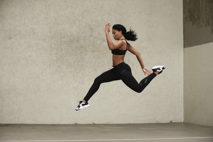 Woman jumping in athletic wear