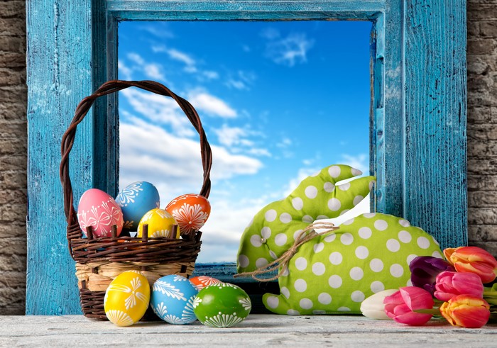 Easter Eggs in Wicker Basket with Tulips and Rabbit