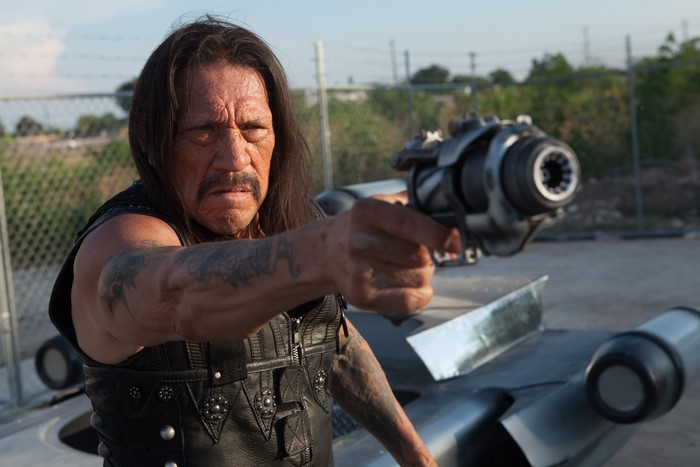 Danny Trejo from Machete Kills holding a futuristic gun