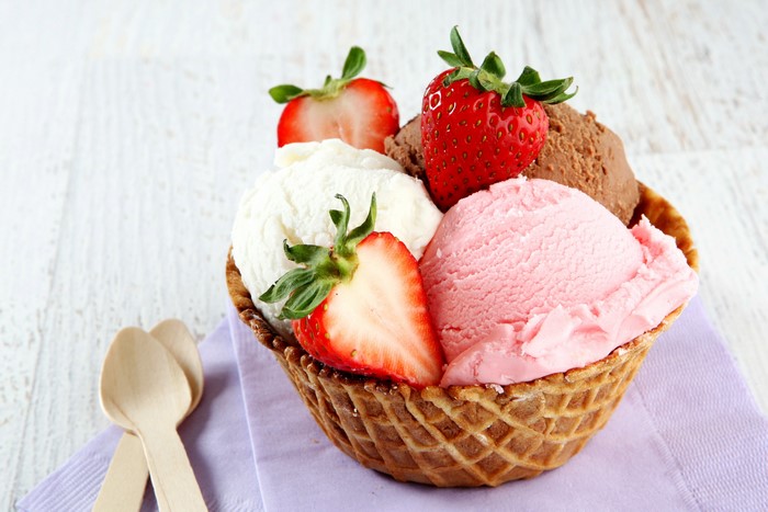 Ice cream with strawberries in a waffle bowl