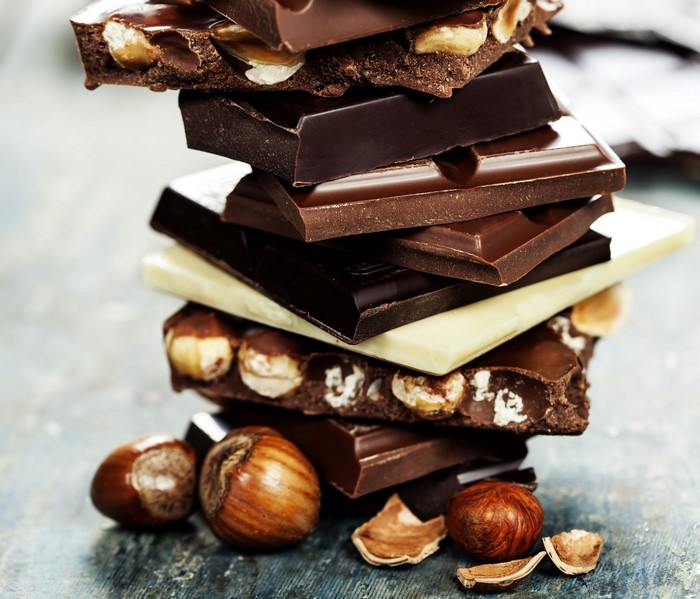 Stack of Chocolate Bars with Hazelnuts and Whole Hazelnuts