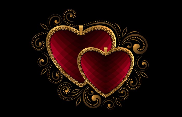 Two red hearts with gold ornaments