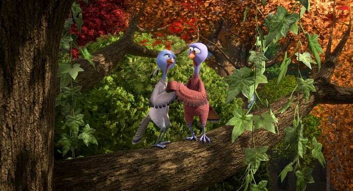 Two turkeys from Free Birds on a tree branch