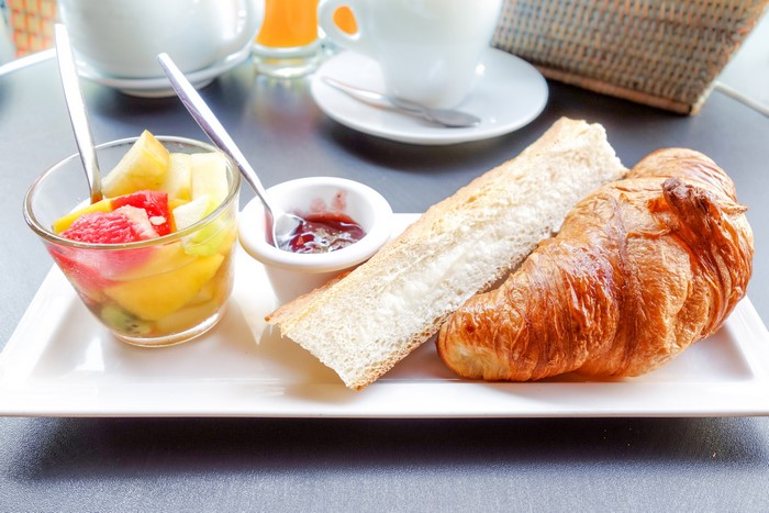 Croissant and Fruit Salad Breakfast