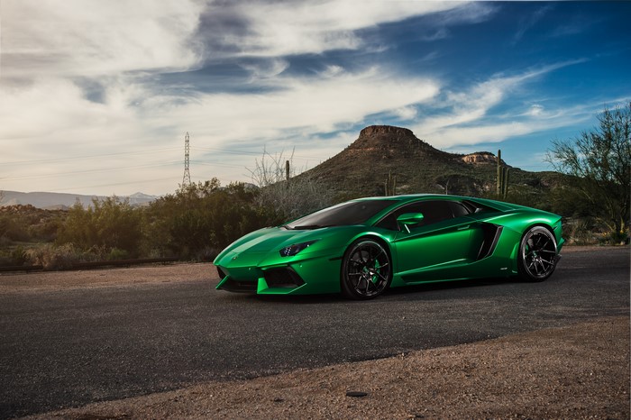 Green Lamborghini Aventador in Desert Landscape